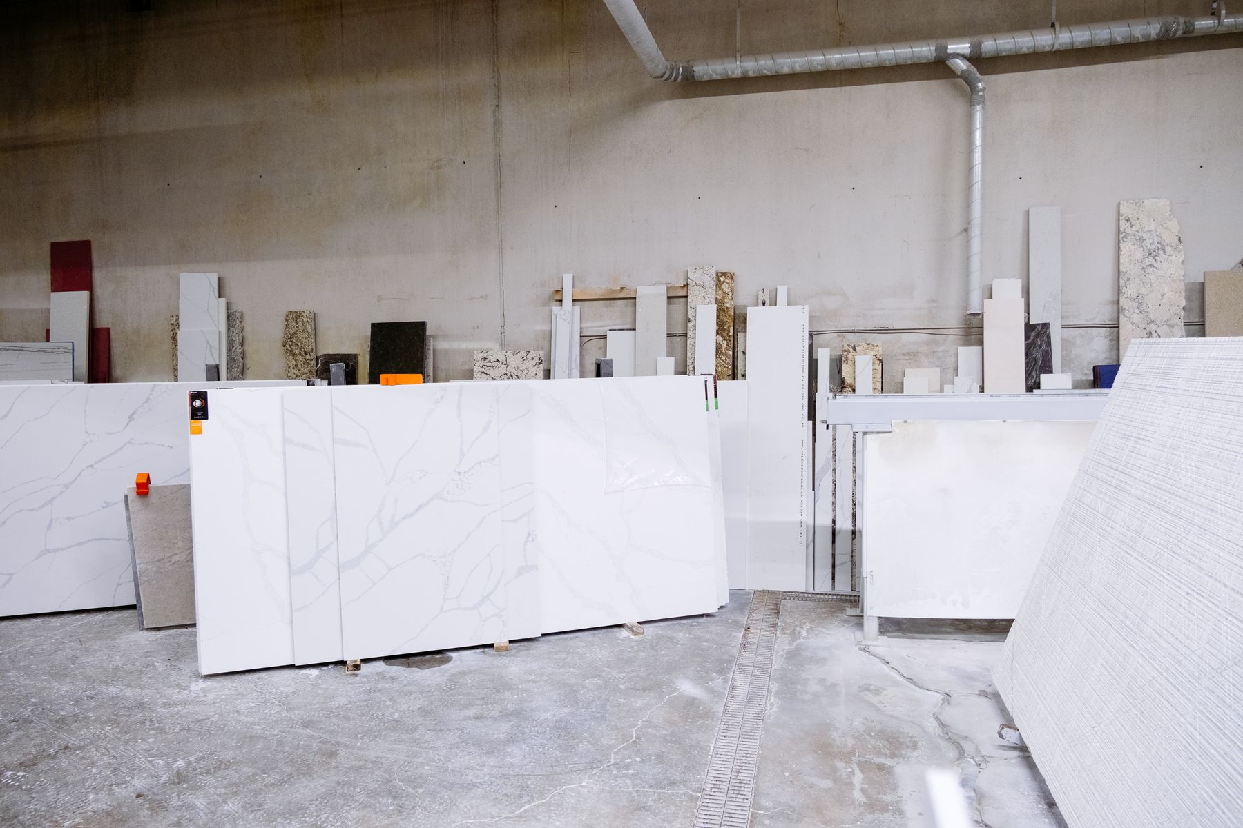 Rows of natural stone slabs inside a processing workshop